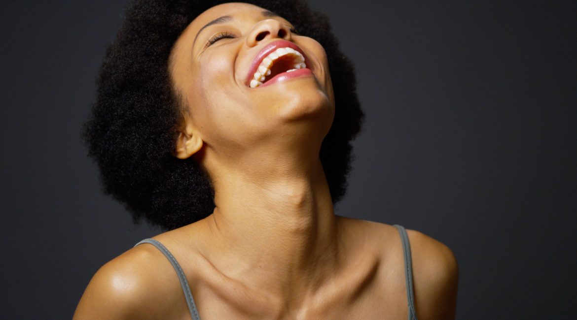 woman laughing upwards