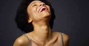 woman laughing upwards