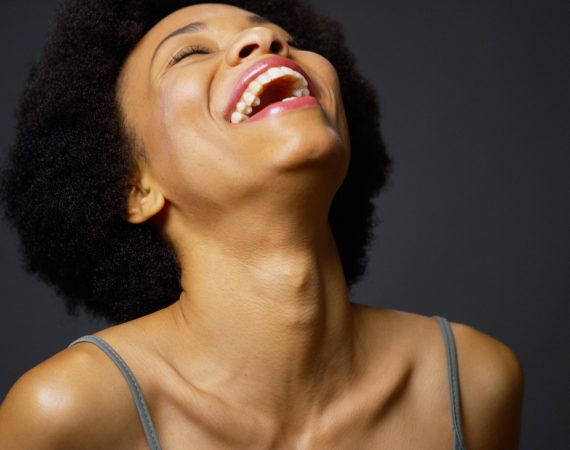 woman laughing upwards